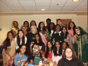 The Shriver LLC members post for a group photo in the Erickson Study lounge. They are dressed in clothing unique to their cultural heritage.